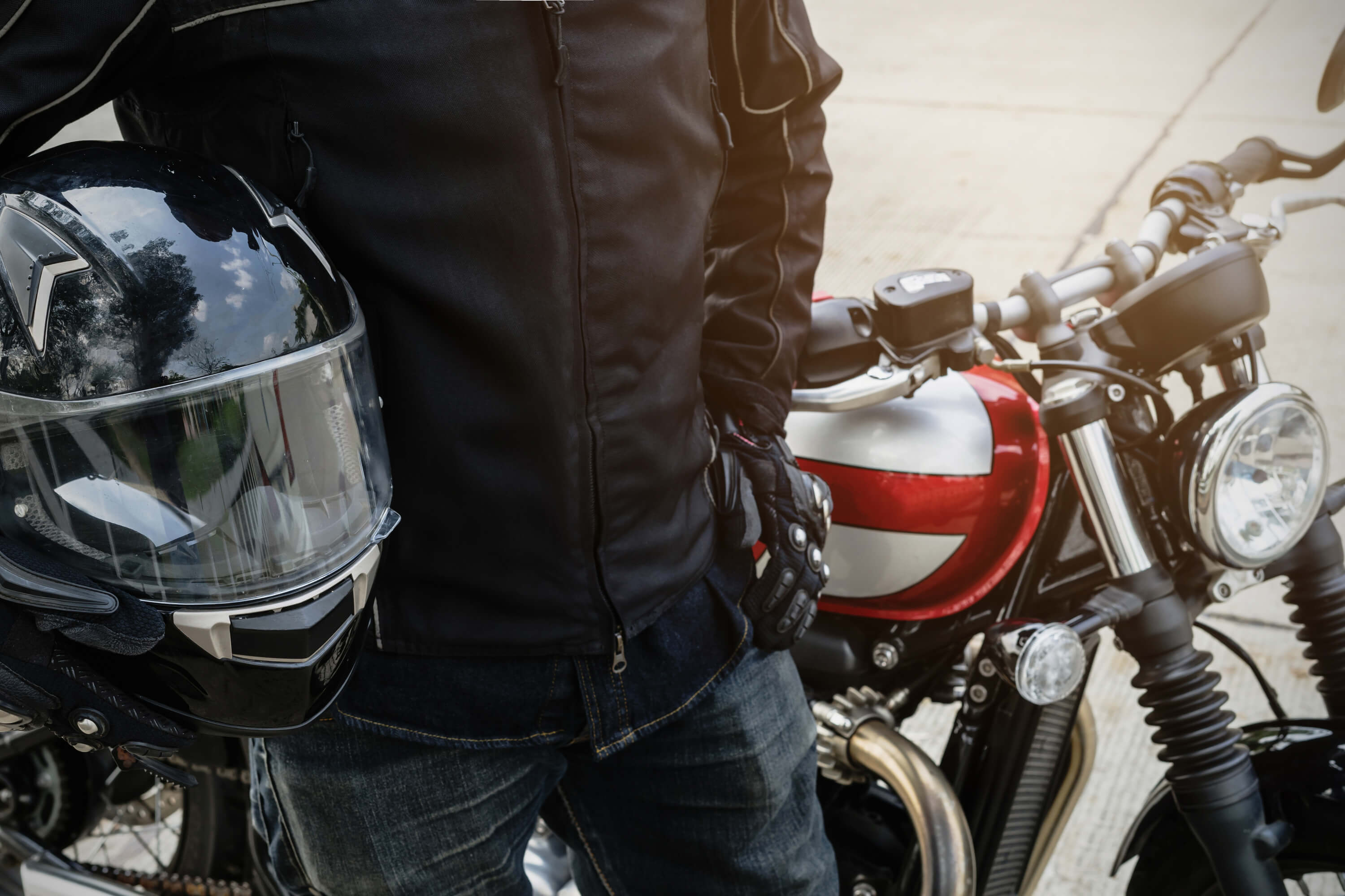 Man stands next to his motorcycle in Florida.